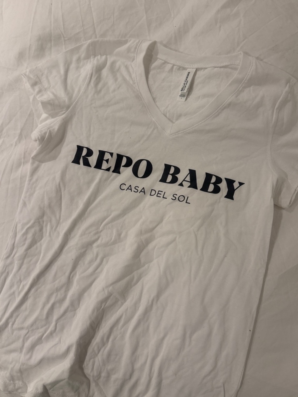 Bella Canvas White V-Neck Tee with Black 'REPO BABY' Print
